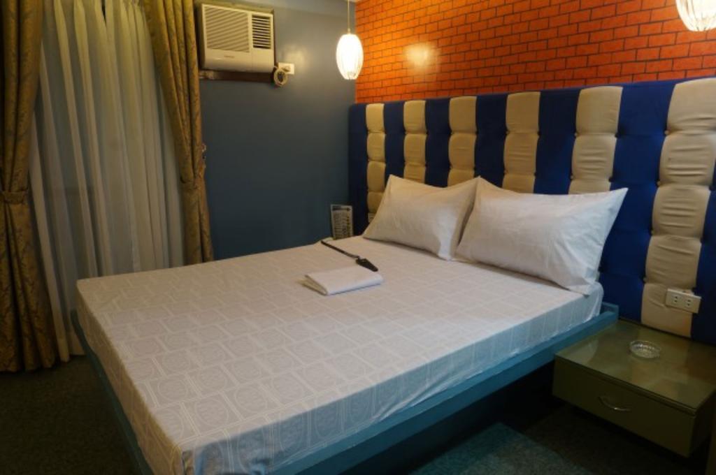 ไอค่อน โฮเต็ล มากาปากัล Hotel มะนิลา ห้อง รูปภาพ